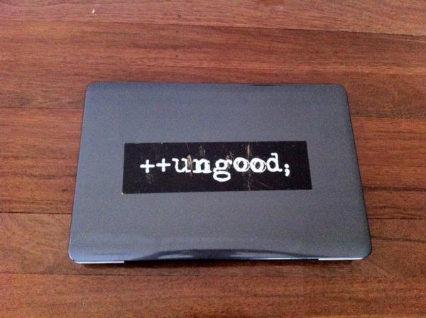 Toshiba Satellite laptop with ++ungood; sticker.