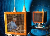 UK-DMC and NigeriaSat-1 undergoing vacuum chamber testing at Rutherford Appleton Laboratory.