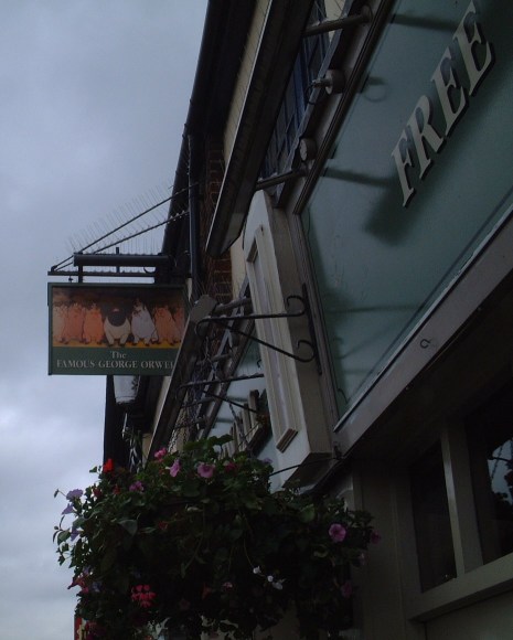 Pub sign at The Famous George Orwell in Hayes, showing a still from Animal Farm.